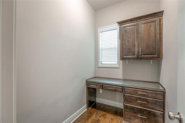 14095 NW 60th Ct, Parkville, MO 64152 - unfurnished office with built in desk and dark wood finished floors