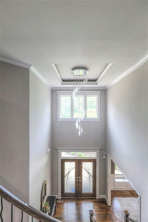 14095 NW 60th Ct, Parkville, MO 64152 - foyer with crown molding, wood finished floors, a raised ceiling, french doors, and a towering ceiling