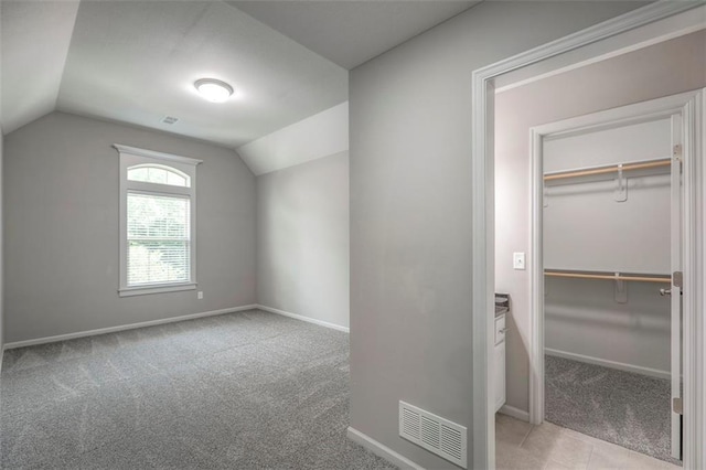 14095 NW 60th Ct, Parkville, MO 64152 - additional living space featuring light carpet and lofted ceiling