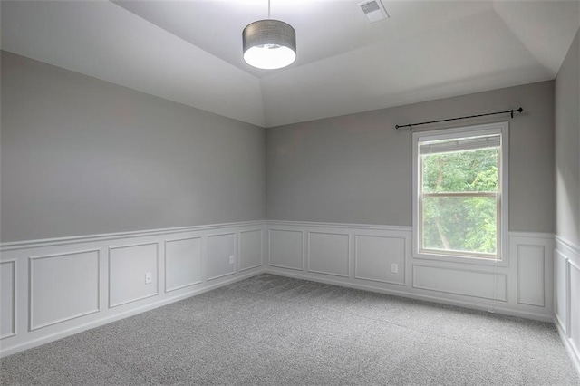 14095 NW 60th Ct, Parkville, MO 64152 - unfurnished room with carpet, vaulted ceiling, a decorative wall, and a wainscoted wall