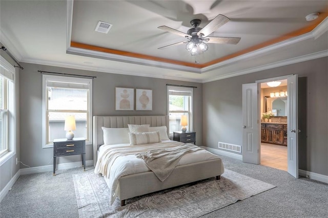 14095 NW 60th Ct, Parkville, MO 64152 - carpeted bedroom featuring a tray ceiling, crown molding, ensuite bathroom, and ceiling fan