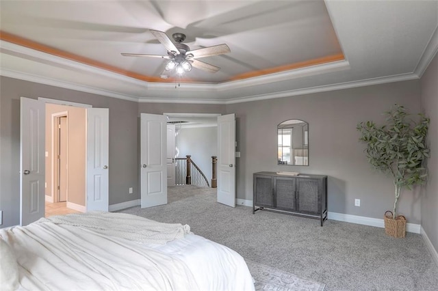 14095 NW 60th Ct, Parkville, MO 64152 - carpeted bedroom featuring a raised ceiling, ornamental molding, and ceiling fan