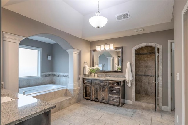 14095 NW 60th Ct, Parkville, MO 64152 - full bath with vanity, ornate columns, a stall shower, a garden tub, and tile patterned floors