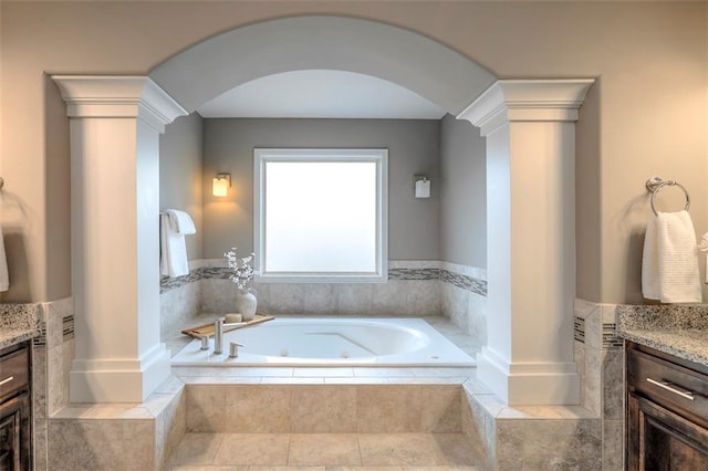 14095 NW 60th Ct, Parkville, MO 64152 - full bathroom featuring vanity, decorative columns, and a tub with jets