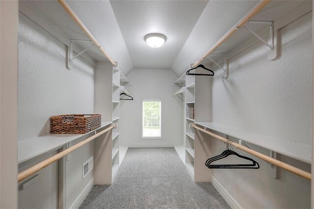 14095 NW 60th Ct, Parkville, MO 64152 - walk in closet featuring carpet floors and vaulted ceiling