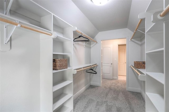 14095 NW 60th Ct, Parkville, MO 64152 - spacious closet featuring carpet flooring and vaulted ceiling