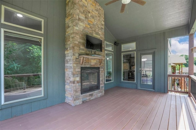 14095 NW 60th Ct, Parkville, MO 64152 - wooden terrace with a ceiling fan and a fireplace
