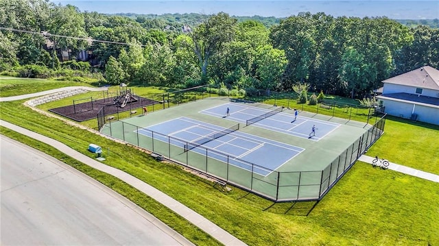 14095 NW 60th Ct, Parkville, MO 64152 - view of tennis court featuring a wooded view