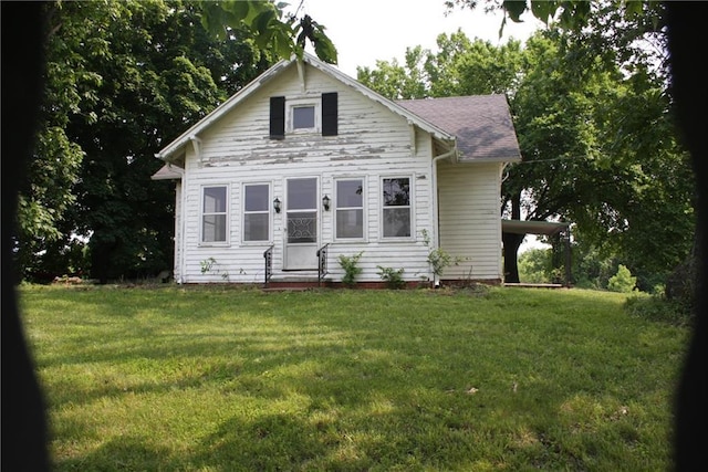 45 SW 675th Rd, Warrensburg, MO 64093 - bungalow-style house with a front yard and roof with shingles