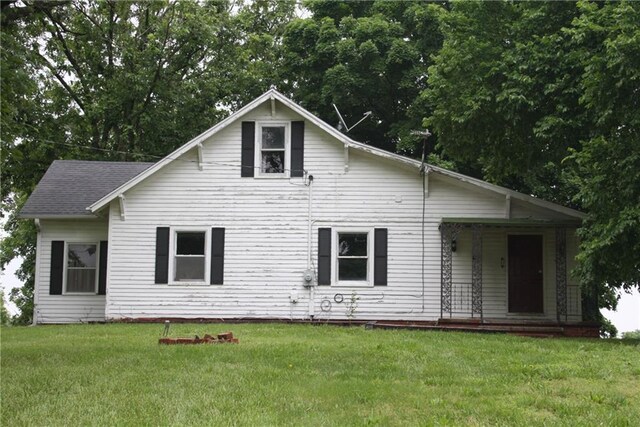 45 SW 675th Rd, Warrensburg, MO 64093 - bungalow-style home with a front yard and covered porch