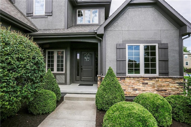 16488 S Summertree Ln, Olathe, KS 66062 - view of exterior entry featuring stucco siding and stone siding