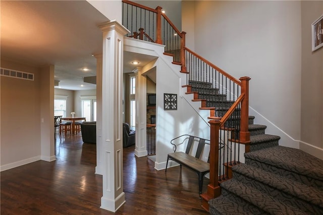 16488 S Summertree Ln, Olathe, KS 66062 - staircase featuring wood finished floors and decorative columns