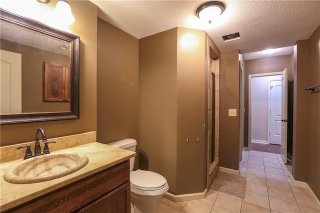 16488 S Summertree Ln, Olathe, KS 66062 - full bathroom featuring vanity, a shower stall, a textured ceiling, and tile patterned flooring