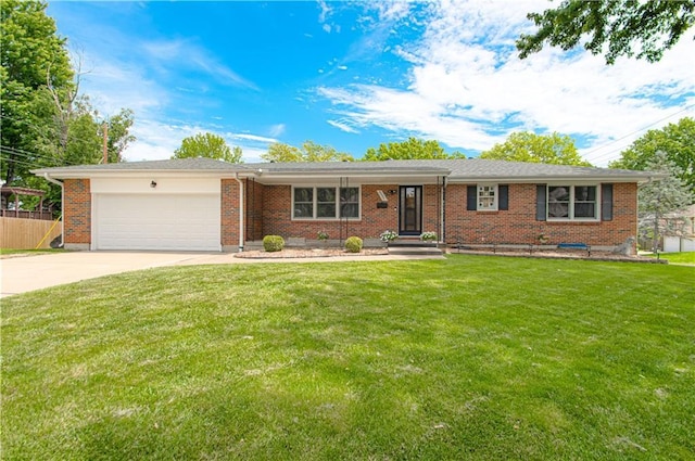 5037 Spring Ave, Kansas City, MO 64133 - single story home with a garage, driveway, and brick siding