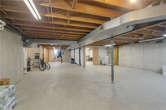 5037 Spring Ave, Kansas City, MO 64133 - unfinished basement with gas water heater