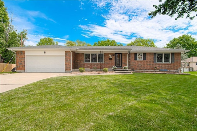 5037 Spring Ave, Kansas City, MO 64133 - ranch-style home with a garage, driveway, and brick siding