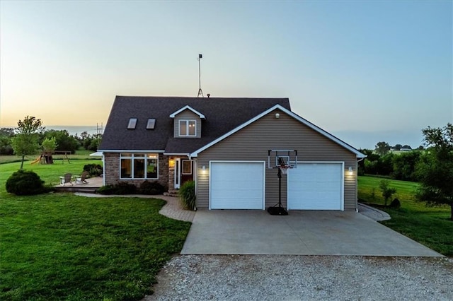 2640 Union Rd, Lawrence, KS 66044 - view of front of house with gravel driveway, a front yard, and a garage