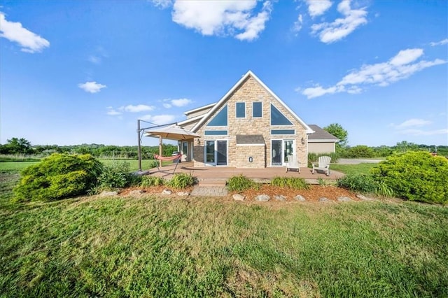 2640 Union Rd, Lawrence, KS 66044 - rear view of property with stone siding, a patio area, and a yard