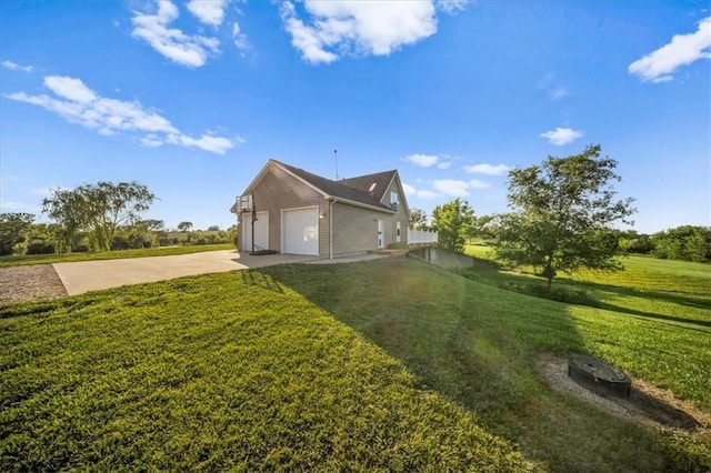 2640 Union Rd, Lawrence, KS 66044 - view of home's exterior with driveway, a garage, and a lawn