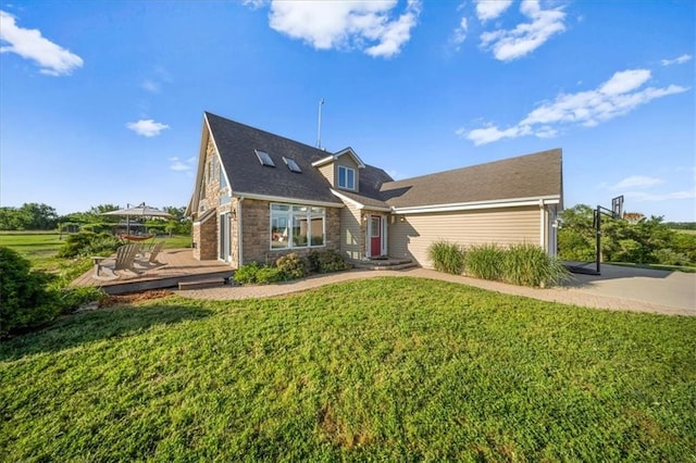 2640 Union Rd, Lawrence, KS 66044 - view of front of house with a front lawn, a deck, and stone siding