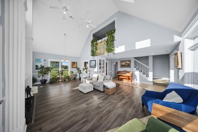 2640 Union Rd, Lawrence, KS 66044 - living area featuring high vaulted ceiling, stairway, wood finished floors, and a ceiling fan