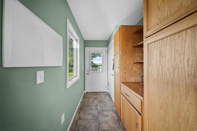 2640 Union Rd, Lawrence, KS 66044 - doorway to outside with baseboards and stone finish flooring