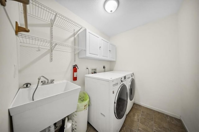 2640 Union Rd, Lawrence, KS 66044 - washroom with cabinet space and separate washer and dryer