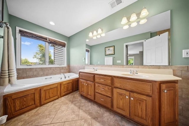 2640 Union Rd, Lawrence, KS 66044 - full bath featuring double vanity, a bath, and tile patterned flooring