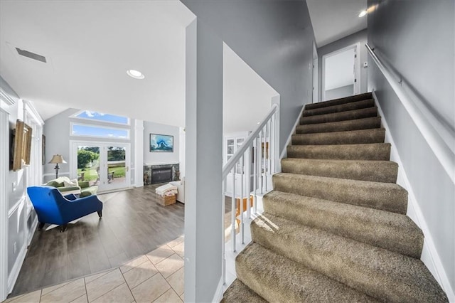 2640 Union Rd, Lawrence, KS 66044 - staircase with lofted ceiling, recessed lighting, and wood finished floors