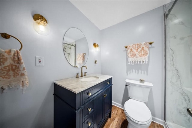 2640 Union Rd, Lawrence, KS 66044 - bathroom with vanity, wood finished floors, a marble finish shower, and vaulted ceiling