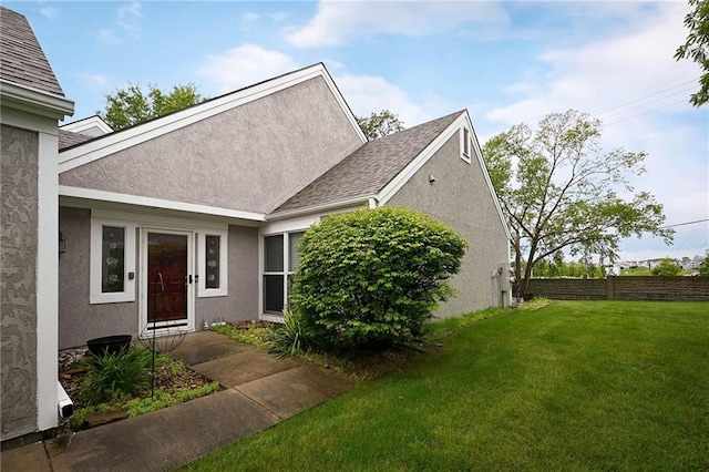404 NE 96th Ter, Kansas City, MO 64155 - entrance to property featuring stucco siding and roof with shingles
