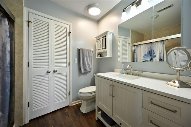 404 NE 96th Ter, Kansas City, MO 64155 - full bath with toilet, a closet, a shower with shower door, and vanity