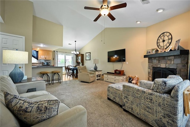 404 NE 96th Ter, Kansas City, MO 64155 - living area featuring carpet floors, a ceiling fan, a stone fireplace, a chandelier, and lofted ceiling