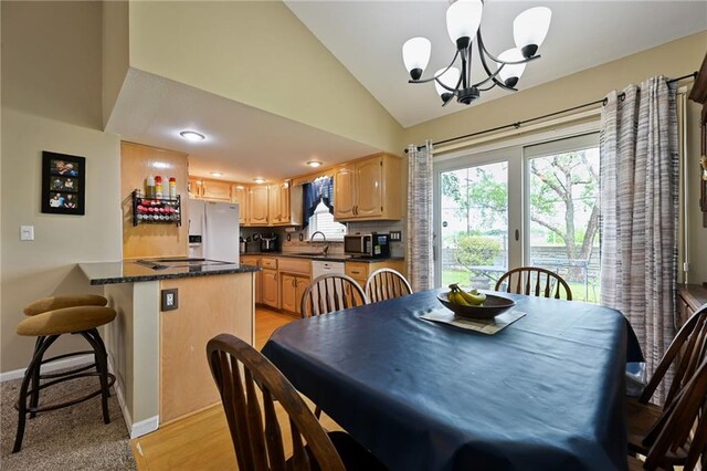 404 NE 96th Ter, Kansas City, MO 64155 - dining room featuring a chandelier, lofted ceiling, baseboards, and recessed lighting