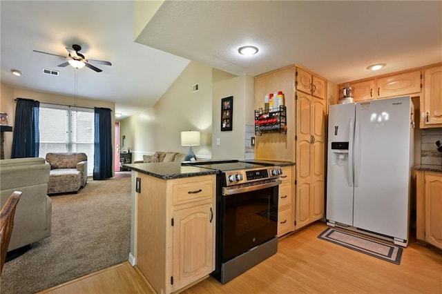 404 NE 96th Ter, Kansas City, MO 64155 - kitchen featuring white refrigerator with ice dispenser, stainless steel range with electric cooktop, open floor plan, ceiling fan, and light wood-style floors