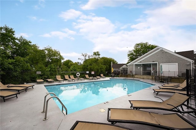 404 NE 96th Ter, Kansas City, MO 64155 - community pool featuring a patio area