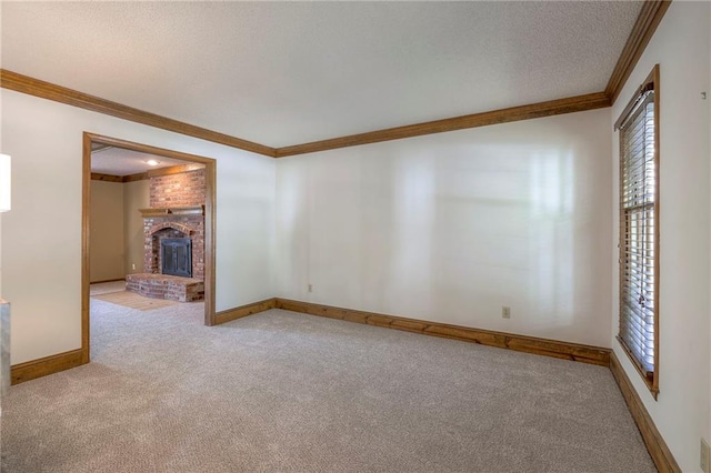 324 N Persimmon Dr, Olathe, KS 66061 - empty room with carpet floors, crown molding, a fireplace, and a textured ceiling