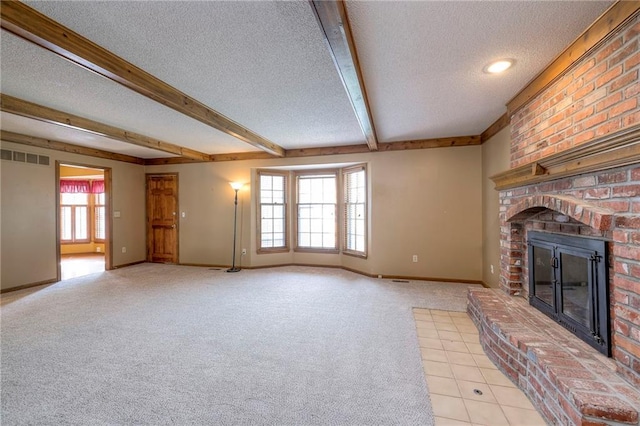 324 N Persimmon Dr, Olathe, KS 66061 - unfurnished living room with a textured ceiling, a brick fireplace, carpet, and beamed ceiling