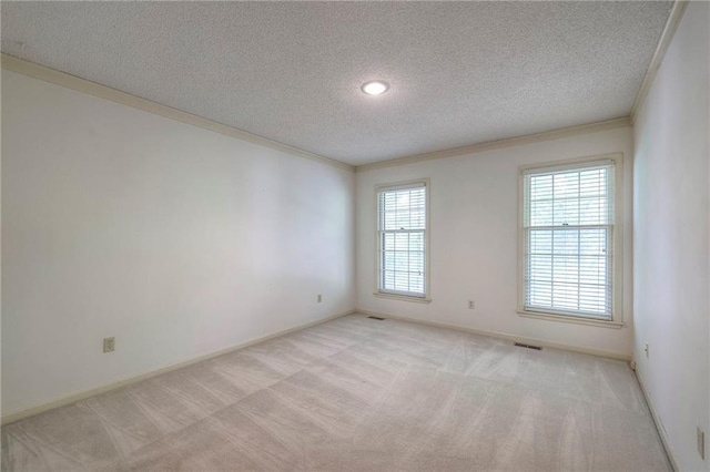 324 N Persimmon Dr, Olathe, KS 66061 - empty room featuring light colored carpet, a textured ceiling, and crown molding