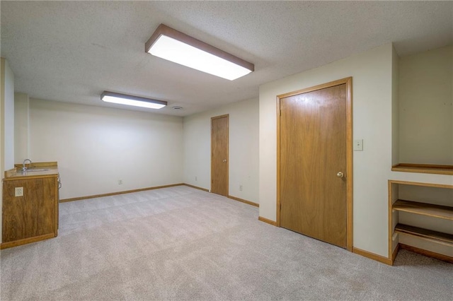 324 N Persimmon Dr, Olathe, KS 66061 - finished below grade area featuring carpet and a textured ceiling