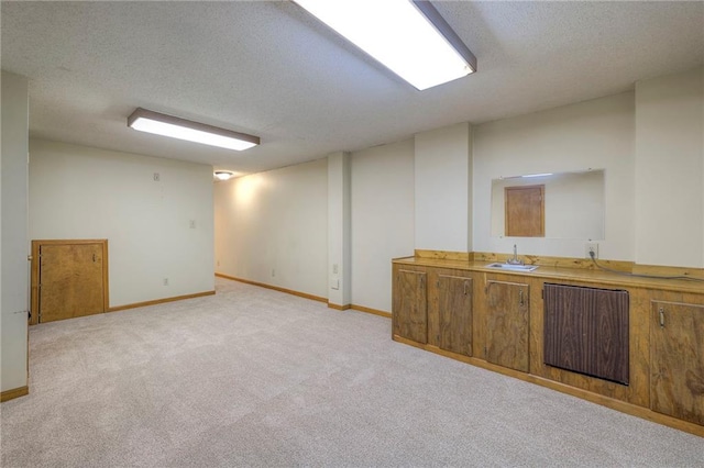 324 N Persimmon Dr, Olathe, KS 66061 - below grade area featuring a textured ceiling and light colored carpet