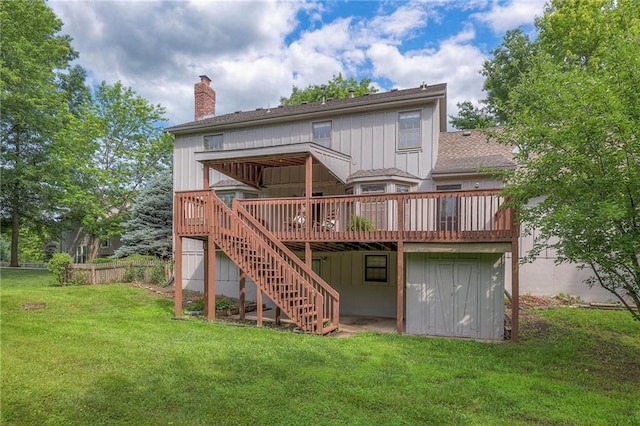 324 N Persimmon Dr, Olathe, KS 66061 - back of house featuring a chimney, a deck, stairway, and a lawn