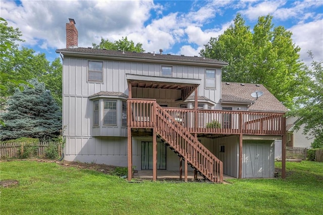 324 N Persimmon Dr, Olathe, KS 66061 - back of house featuring a deck, stairway, a chimney, and board and batten siding