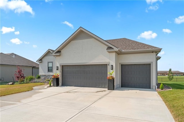 21115 W 186th Ter, Spring Hill, KS 66083 - view of front of property featuring stucco siding, a garage, driveway, and a front yard