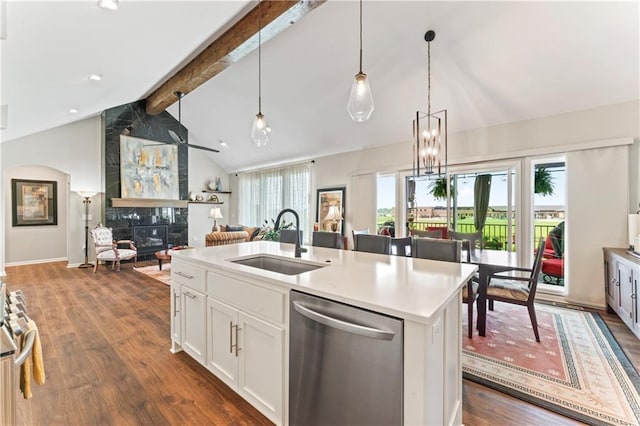 21115 W 186th Ter, Spring Hill, KS 66083 - kitchen featuring appliances with stainless steel finishes, a sink, beam ceiling, a fireplace, and dark wood-style flooring
