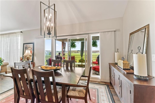 21115 W 186th Ter, Spring Hill, KS 66083 - dining space featuring healthy amount of natural light, wood finished floors, and a chandelier