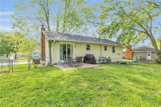 2604 S 16th Ter, Leavenworth, KS 66048 - rear view of property with a chimney, board and batten siding, and a patio area