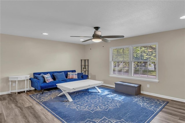 2604 S 16th Ter, Leavenworth, KS 66048 - sitting room featuring ceiling fan, wood finished floors, baseboards, recessed lighting, and a textured ceiling