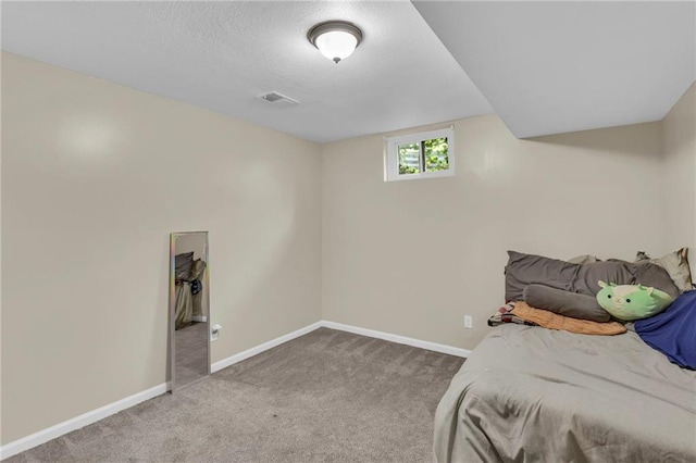2604 S 16th Ter, Leavenworth, KS 66048 - bedroom with carpet floors, baseboards, and a textured ceiling