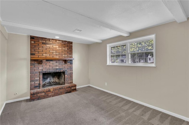 2604 S 16th Ter, Leavenworth, KS 66048 - unfurnished living room featuring beamed ceiling, carpet flooring, a fireplace, and baseboards